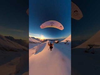 Paraglider Flies and Skis Over Golden Hour Mountains || ViralHog